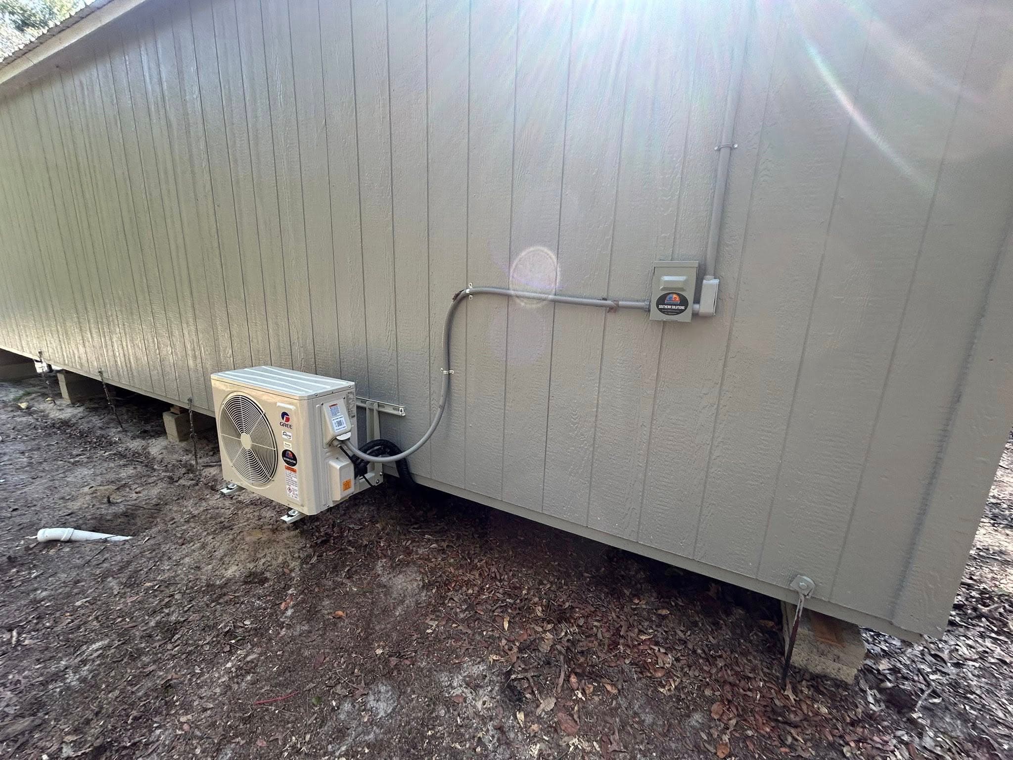 New Goodman condenser unit installed outside a home in Alachua County
